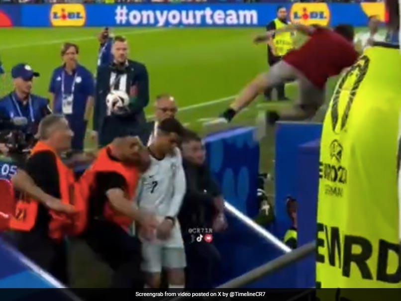 Cristiano Ronaldo Escapes Getting Kicked As Crazy Fan Jumps On Star During Euro Match. Watch